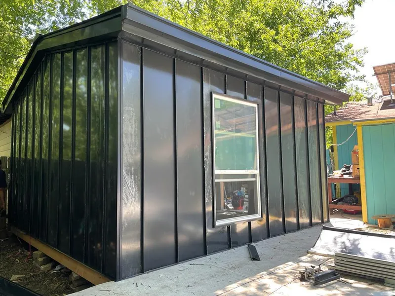 Black standing seam metal wall panels for Roof Inspection in Krum